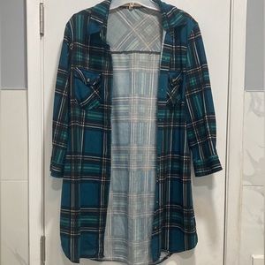 Long, green plaid shirt.